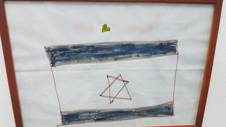 disegno bambina siriana bandiera israele